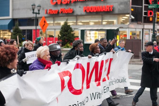 Demonstrators march  toward City Hall in response to an incident last week where two black men were arrested in a Center City Starbucks. (Brad Larrison for WHYY)