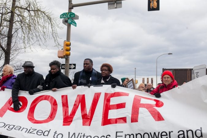 Demonstrators march  toward City Hall in response to an incident last week where two black men were arrested in a Center City Starbucks. (Brad Larrison for WHYY)