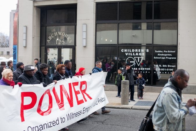 Demonstrators march  toward City Hall in response to an incident last week where two black men were arrested in a Center City Starbucks. (Brad Larrison for WHYY)