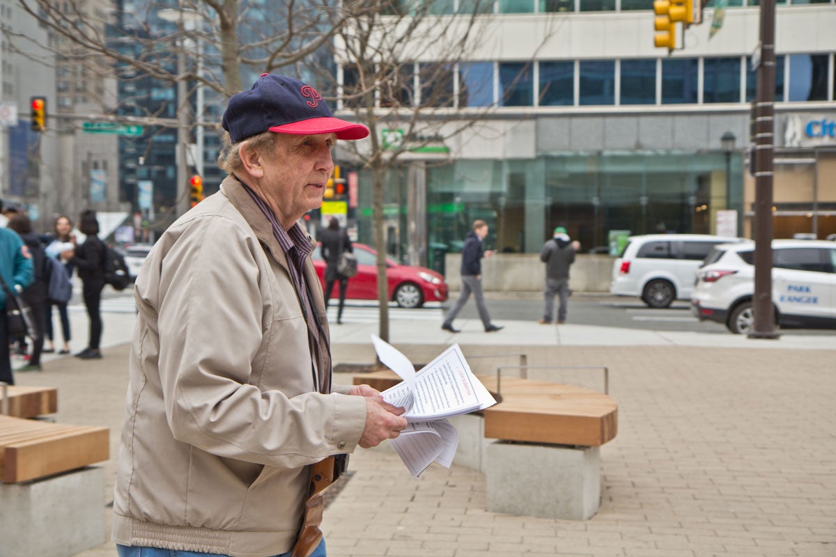 Steve Perzan, retired Philadelphia resident, hands out flyers with his Love Park criticisms.