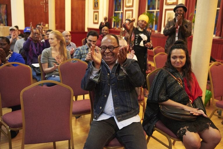 Dr. Tony Monteiro applauds during 