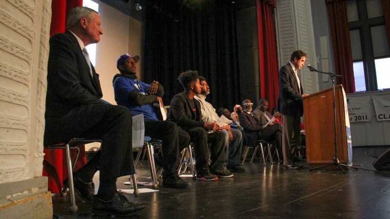 Philadelphia Mayor Jim Kenney (left) listens as Mastery Charter CEO Scott Gordon talks about gun violence and problems with charter renewals and funding. (Emma Lee/WHYY)