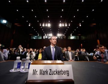 Facebook CEO Mark Zuckerberg takes his seat after a break to continue to testify before a joint hearing of the Commerce and Judiciary Committees on Capitol Hill in Washington, Tuesday, April 10, 2018, about the use of Facebook data to target American voters in the 2016 election. (AP Photo/Alex Brandon)