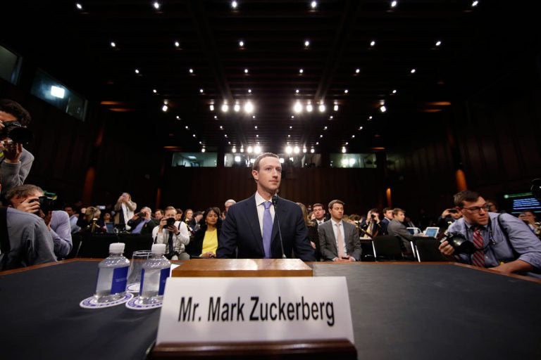 Facebook CEO Mark Zuckerberg takes his seat after a break to continue to testify before a joint hearing of the Commerce and Judiciary Committees on Capitol Hill in Washington, Tuesday, April 10, 2018, about the use of Facebook data to target American voters in the 2016 election. (AP Photo/Alex Brandon)