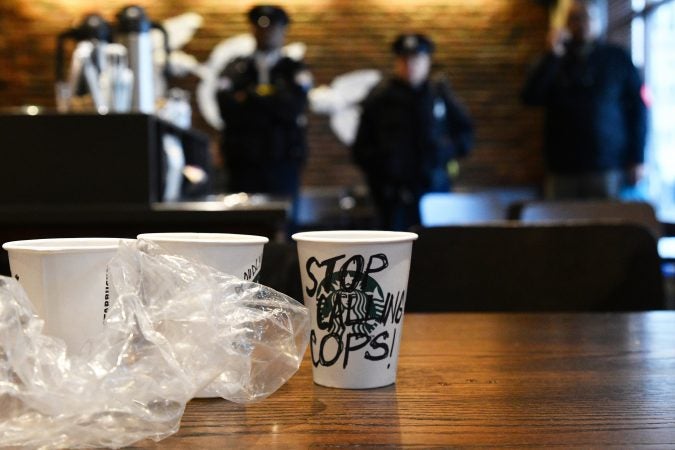 An estimated 50 gathered inside the Starbucks near Rittenhouse Square on Monday morning to protest the recent arrest at that location. (Bastiaan Slabbers for WHYY)