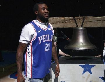 Rapper Meek Mill comes out to ring the ceremonial Liberty Bell replica before Tuesday’s first-round NBA playoff game in Philadelphia Tuesday night. (Chris Szagola/AP)