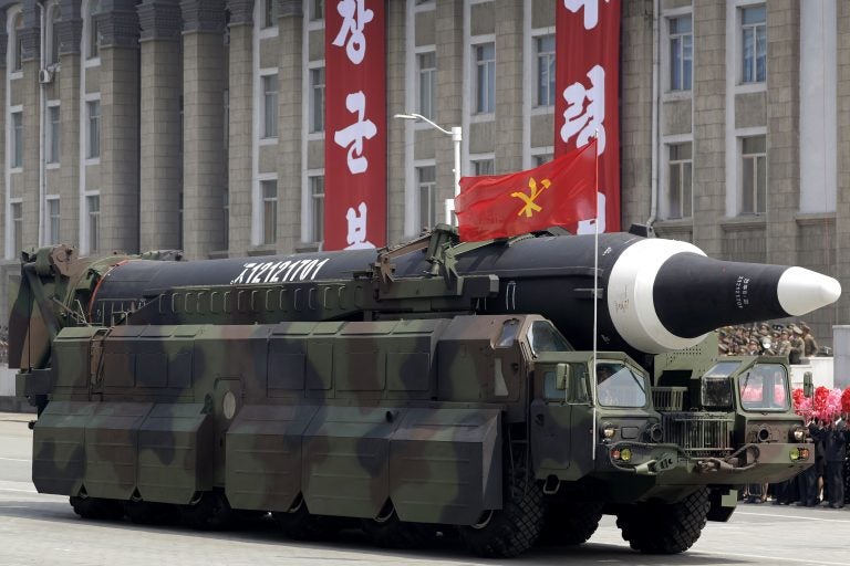 FILE - In this April 15, 2017, file photo, an unidentified missile that analysts believe could be the North Korean Hwasong 12 is paraded in Kim Il Sung Square in Pyongyang, North Korea. Many analysts believe the missile could be a stepping stone to the ICBM North Korea needs to attack the U.S. mainland. (AP Photo/Wong Maye-E, File)