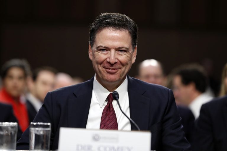 Former FBI Director James Comey smiles during a Senate Intelligence Committee hearing on Capitol Hill, Thursday, June 8, 2017, in Washington.