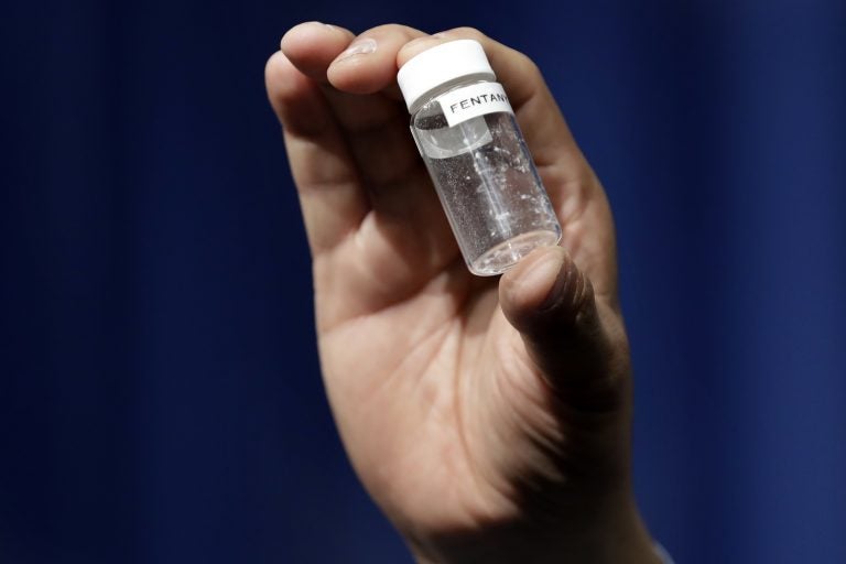 In this June 6, 2017 file photo, a reporter holds up an example of the amount of fentanyl that can be deadly after a news conference about deaths from fentanyl exposure, at DEA Headquarters in Arlington Va. (Jacquelyn Martin/AP Photo, File)