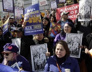 Protesters gather during a demonstration involving various labor union groups Monday, Feb. 26, 2018, in San Francisco. The Supreme Court is divided in a major organized labor case over 