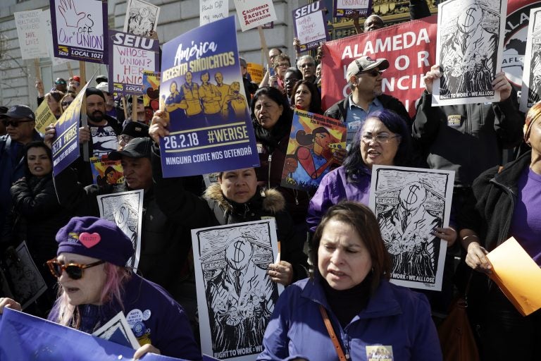 Protesters gather during a demonstration involving various labor union groups Monday, Feb. 26, 2018, in San Francisco. The Supreme Court is divided in a major organized labor case over 