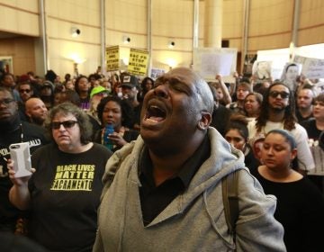 Demonstrators gather outside the entrance to the Sacramento City Council chambers to protest the shooting death of Stephon Clark by Sacramento police, Tuesday, March 27, 2018, in Sacramento,