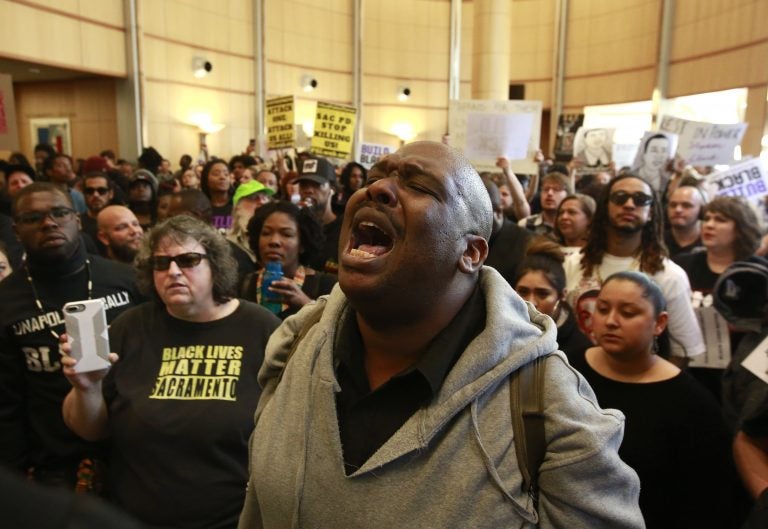 Demonstrators gather outside the entrance to the Sacramento City Council chambers to protest the shooting death of Stephon Clark by Sacramento police, Tuesday, March 27, 2018, in Sacramento,