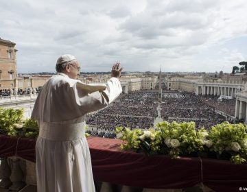 Pope Francis delivers the Urbi et Orbi (to the city and to the world) blessing at the end of the Easter Sunday Mass in St. Peter's Square at the Vatican, Sunday, April 1, 2018. (Vatican Media via AP)