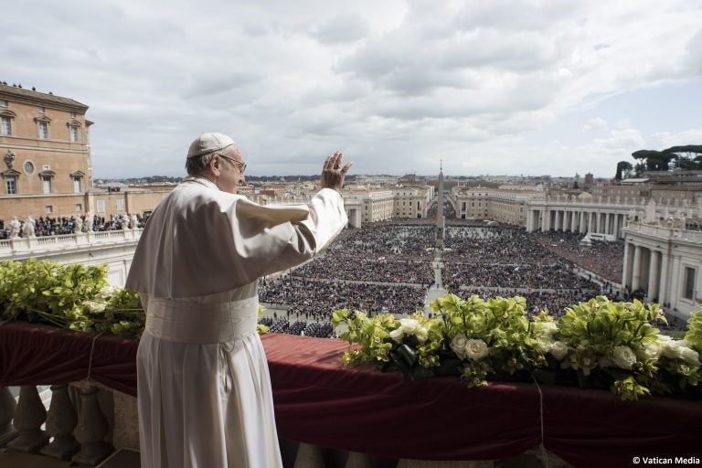 Pope Francis delivers the Urbi et Orbi (to the city and to the world) blessing at the end of the Easter Sunday Mass in St. Peter's Square at the Vatican, Sunday, April 1, 2018. (Vatican Media via AP)