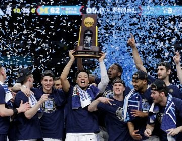 Villanova players celebrate with the trophy after beating Michigan 79-62 in the championship game of the Final Four NCAA college basketball tournament, Monday, April 2, 2018, in San Antonio.