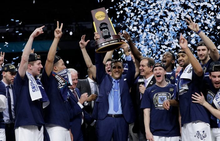 Villanova head coach Jay Wright, center, celebrates with his team after beating Michigan 79-62 in the championship game of the Final Four NCAA college basketball tournament, Monday, April 2, 2018, in San Antonio. (AP Photo/David J. Phillip)