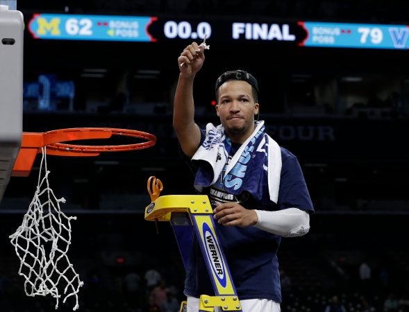 Villanova's Jalen Brunson cuts the net as he celebrates after the championship game of the Final Four NCAA college basketball tournament against Michigan, Monday, April 2, 2018, in San Antonio. Villanova won 79-62. (AP Photo/David J. Phillip)