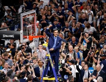 Villanova head coach Jay Wright reacts after cutting down the net after beating Michigan 79-62 in the championship game of the Final Four NCAA college basketball tournament, Monday, April 2, 2018, in San Antonio. (AP Photo/Brynn Anderson)