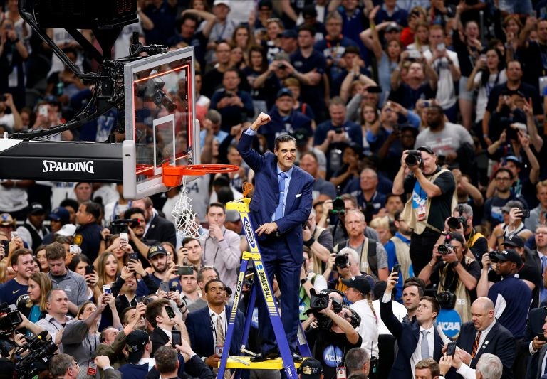 Villanova head coach Jay Wright reacts after cutting down the net after beating Michigan 79-62 in the championship game of the Final Four NCAA college basketball tournament, Monday, April 2, 2018, in San Antonio. (AP Photo/Brynn Anderson)