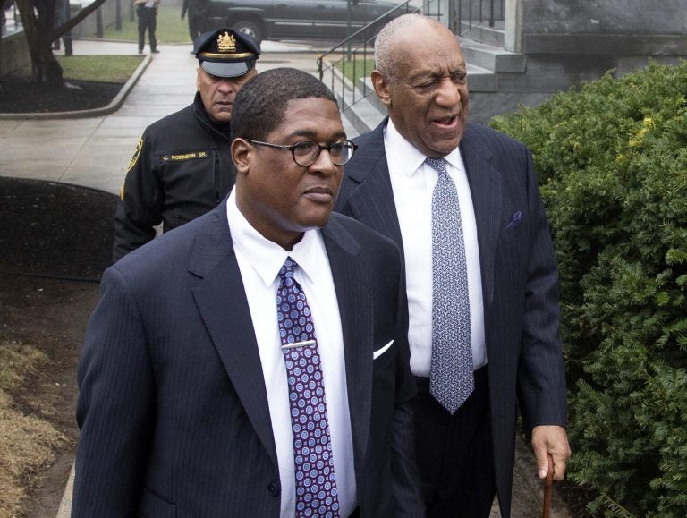 Bill Cosby, right, arrives for his sexual assault case spokesperson Andrew Wyatt, center, at the Montgomery County Courthouse, Wednesday, April 4, 2018, in Norristown, Pa.