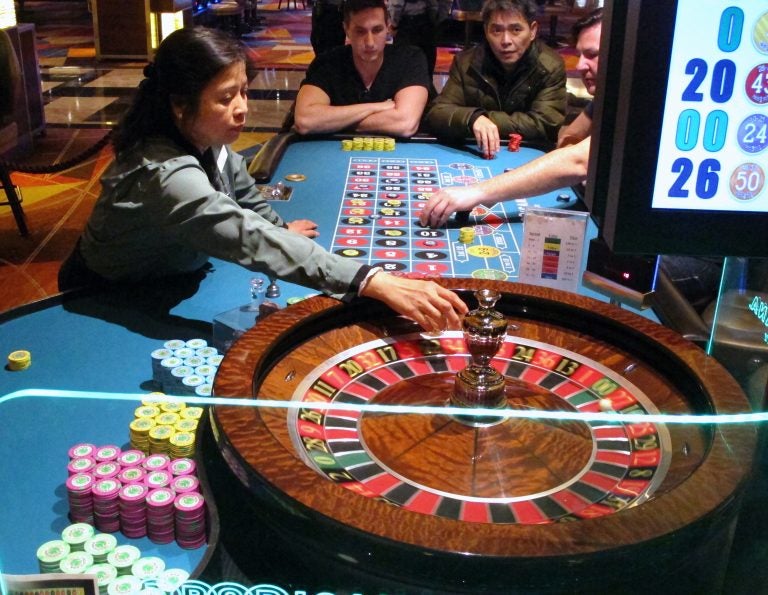 This Jan. 31, 2018, photo shows a dealer conducting a game of roulette at the Tropicana Casino and Resort in Atlantic City N.J. Atlantic City's seven casinos saw their gross operating profits increase by 22.5 percent last year, to $723 million. (AP Photo/Wayne Parry)