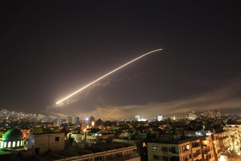 The Damascus sky lights up missile fire as the U.S. launches an attack on Syria targeting different parts of the capital early Saturday, April 14, 2018. Syria's capital has been rocked by loud explosions that lit up the sky with heavy smoke as U.S. President Donald Trump announced airstrikes in retaliation for the country's alleged use of chemical weapons. (Hassan Ammar/AP Photo)