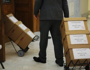 Boxes of documents are wheeled into the courtroom before actor and comedian Bill Cosby arrives for his sexual assault retrial at the Montgomery County Courthouse in Norristown, Pa., Monday, April 16, 2018.