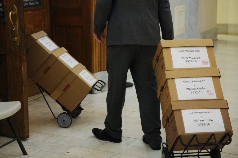 Boxes of documents are wheeled into the courtroom before actor and comedian Bill Cosby arrives for his sexual assault retrial at the Montgomery County Courthouse in Norristown, Pa., Monday, April 16, 2018.