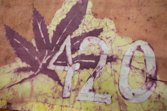This Friday, April 13, 2018, photo, shows a Waldos 420 flag from 1972 made by a classmate at San Rafael High School, at a bank vault in San Francisco. Friday is April 20, or 4/20. That’s the numerical code for marijuana’s high holiday, a celebration and homage to pot’s enduring and universal slang for smoking. And five Northern California high school stoner buddies widely credited with creating the shorthand slang for getting high nearly 50 years ago now serve as the day's unofficial grand masters.  (Eric Risberg/AP Photo)