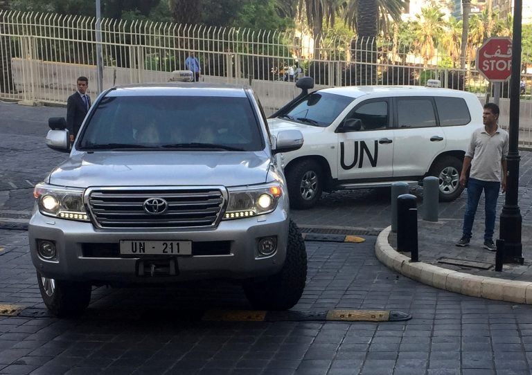 In this Saturday, April 14, 2018 file photo, UN vehicles carrying the team of the Organization for the Prohibition of Chemical Weapons (OPCW), arrive at hotel hours after the U.S., France and Britian launched an attack on Syrian facilities for suspected chemical attack against civilians, in Damascus, Syria. The OPCW has been thrust once again into the international limelight by a nerve agent attack on a former Russian spy in Britain and allegations of a chemical bombardment on the Syrian city of Douma. It is now attempting to investigate, but its experts have not yet been able to visit the scene. (Bassem Mroue/AP Photo, File)