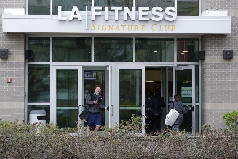 A person leaves an LA Fitness gym while a group of women enter the club, Thursday, April 19, 2018, in Secaucus, N.J. Employees of the LA Fitness wrongly accused a black member and his guest of not paying to work out and called police, prompting an apology from the company. (Julio Cortez/AP Photo)