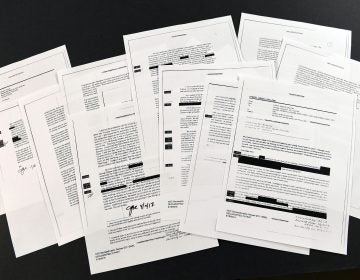 Copies of the memos written by former FBI Director James Comey are photographed in Washington, Thursday, April 19, 2018. President Donald Trump told former FBI Director James Comey that he had serious concerns about the judgment of his first national security adviser, Michael Flynn, according to memos maintained by Comey and obtained by The Associated Press. The 15 pages of documents contain new details about a series of interactions that Comey had with Trump in the weeks before his May 2017 firing. Those encounters include a White House dinner at which Comey says Trump asked him for his loyalty. (Susan Walsh/AP Photo)