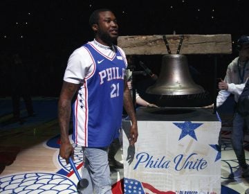 Rapper Meek Mill comes out to ring a Liberty Bell replica before the first half in Game 5 of a first-round NBA basketball playoff series between the Miami Heat and the Philadelphia 76ers, Tuesday, April 24, 2018, in Philadelphia. (AP Photo/Chris Szagola)