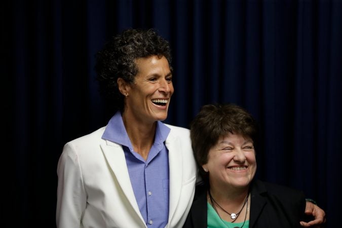 Bill Cosby accuser Andrea Constand, left, and her attorney Dolores Troiani, laugh during a news conference after Cosby was found guilty in his sexual assault trial, Thursday, April 26, 2018, in Norristown, Pa. (AP Photo/Matt Slocum)