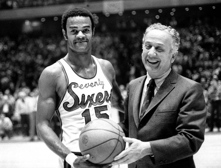 Hal Greer (15), of the Philadelphia 76ers, accepts ball from Sixers owner Irv Koslof