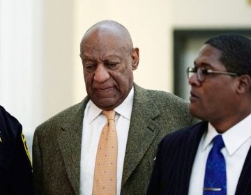 Actor and comedian Bill Cosby, (left), walks with his spokesman Andrew Wyatt, during his sexual assault retrial at the Montgomery County Courthouse in Norristown, Pa., Monday, April 23, 2018. (Jessica Kourkounis/Pool Photo via AP)