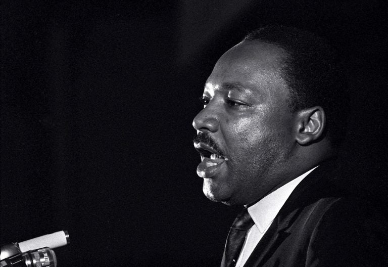 In this April 3, 1968 file photo, Dr. Martin Luther King Jr. makes his last public appearance at the Mason Temple in Memphis, Tenn. The following day King was assassinated on his motel balcony. (Charles Kelly/AP Photo, File)