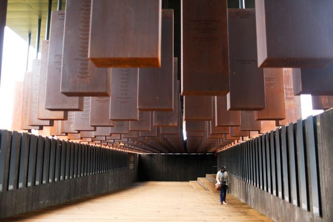 This photo shows part of the display at the National Memorial for Peace and Justice, a new memorial to honor thousands of people killed in racist lynchings, Monday, April 23, 2018, in Montgomery, Ala. The national memorial aims to teach about America's past in hope of promoting understanding and healing. It's scheduled to open on Thursday. (Brynn Anderson/AP Photo)