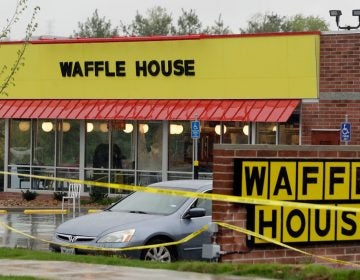 Police tape blocks off a Waffle House restaurant Sunday, April 22, 2018, in Nashville, Tenn. At least four people died after a gunman opened fire at the restaurant early Sunday. (Mark Humphrey/AP Photo)