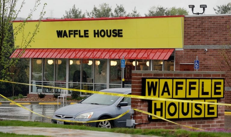 Police tape blocks off a Waffle House restaurant Sunday, April 22, 2018, in Nashville, Tenn. At least four people died after a gunman opened fire at the restaurant early Sunday. (Mark Humphrey/AP Photo)