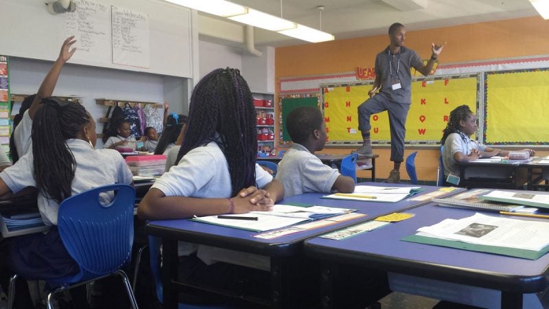 Hayes moves all around the room while teaching, a dynamic presence. (Kevin McCorry/WHYY)