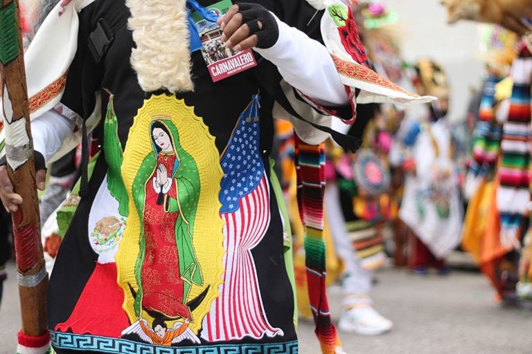 The Virgin of Guadalupe, an iconic image in Mexican culture, adorns the costumes of carnavaleros, the performers in the yearly festival, Carnaval de Puebla.