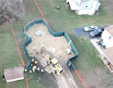 Crews work to stabilize sinkholes in a West Whiteland Township neighborhood on March 3. The sinkholes appeared recently near a construction site for the Mariner East 2 pipeline. The PUC ordered Sunoco to shut down nearby Mariner East 1 until it can prove the line is safe to operate amid the sinkholes and geology of the region. (Eric Friedman)