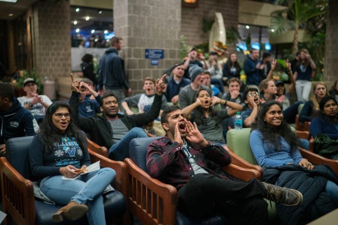 Villanova students gather at the Connelly Center to watch the 
men's basketball team play in the NCAA Championship against Michigan. (Branden Eastwood for WHYY)