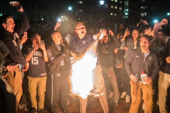 Villanova students celebrates as the men's basketball team wins the NCAA championship. (Branden Eastwood for WHYY)