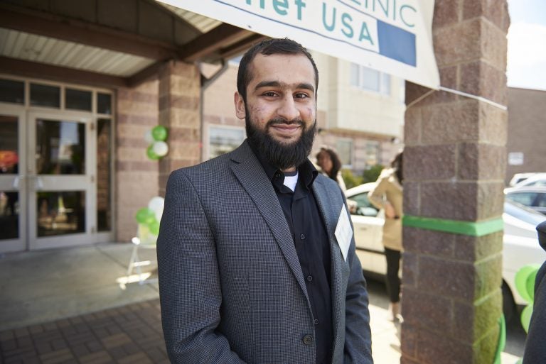 Outreach coordinator and board member Maaz Baqai stands outside SHAMS Clinic on Frankford Avenue during the grand opening event on Sunday, April 8, 2018. (Natalie Piserchio/for WHYY)
