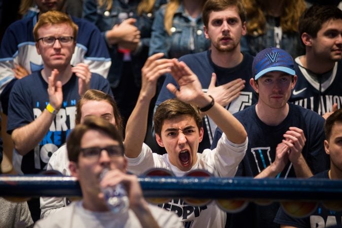 Villanova students respond to a tough start for their team during the NCAA men's basketball championship game. (Branden Eastwood for WHYY)