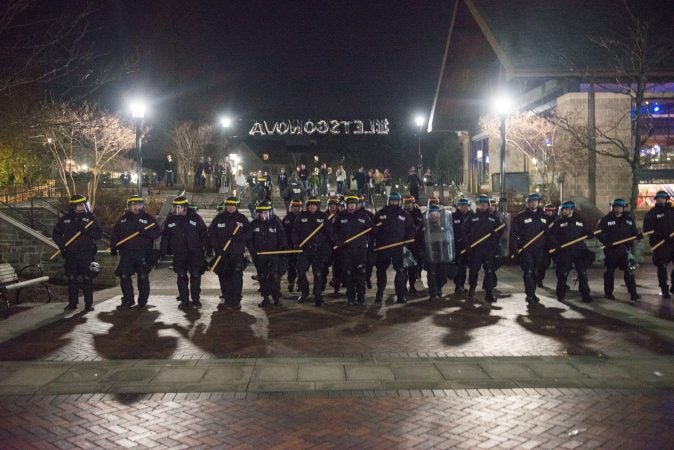 Riot police take move towards a crowd of disruptive students at Villanova Univeristy. (Branden Eastwood for WHYY)