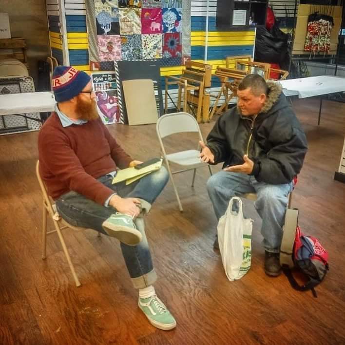 The Renegade Company's Mike Durkin (left) collecting a resident's story (Dennis Payne)